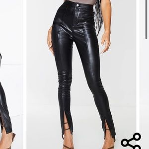 PrettyLittleThing black split hem faux leather skinny pants. High waited fit.